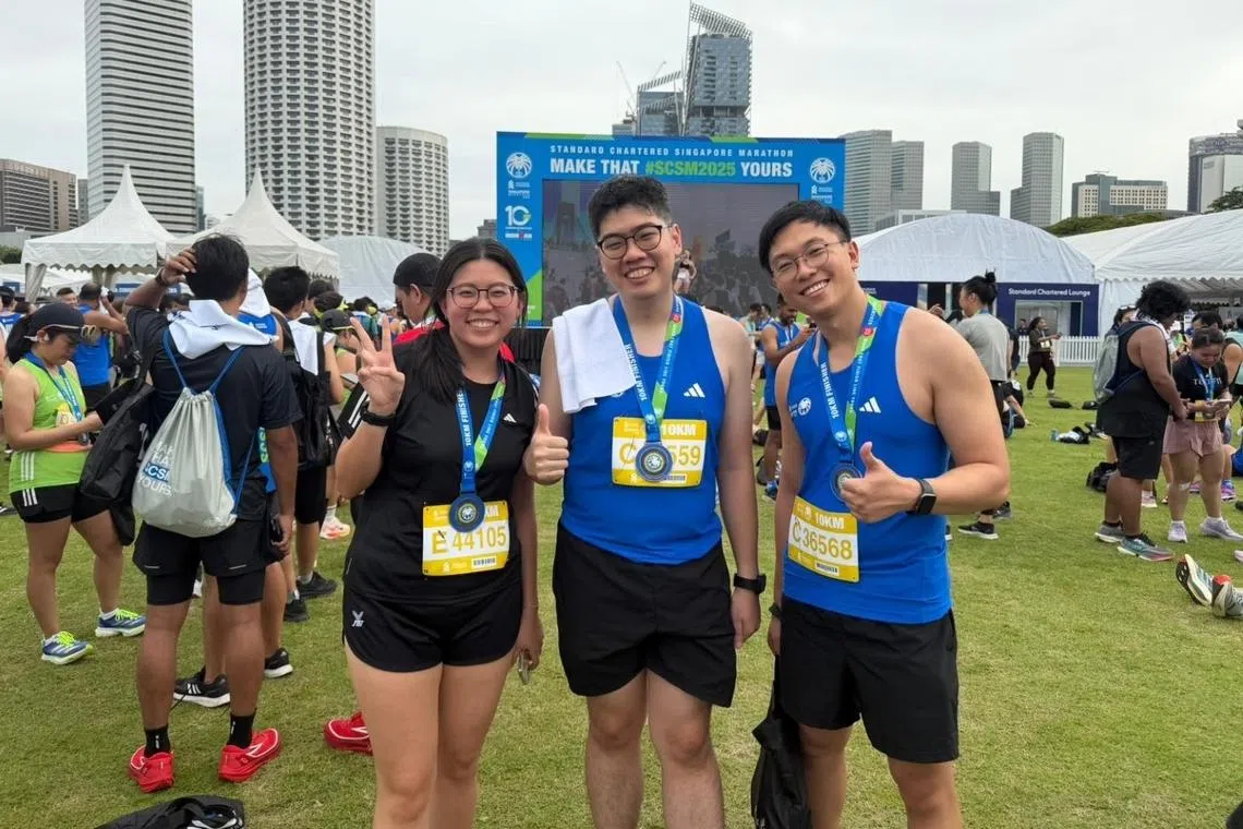 mr lim (far right) and ms kwek with a colleague at the standard chartered marathon 2025 sponsored by dso showing one of many ways the organisation brings employees together outside of work