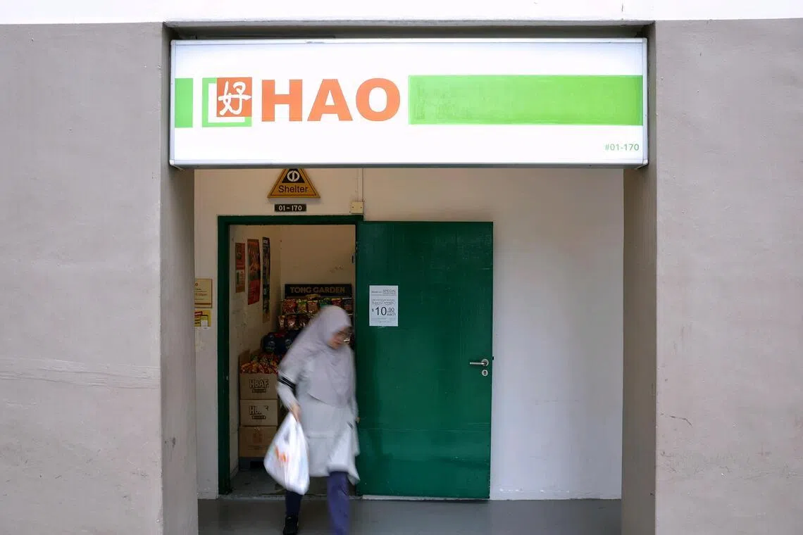 The facade of Hao Mart in Pasir Ris, with the words Halal Hub masked by a thick green border.
