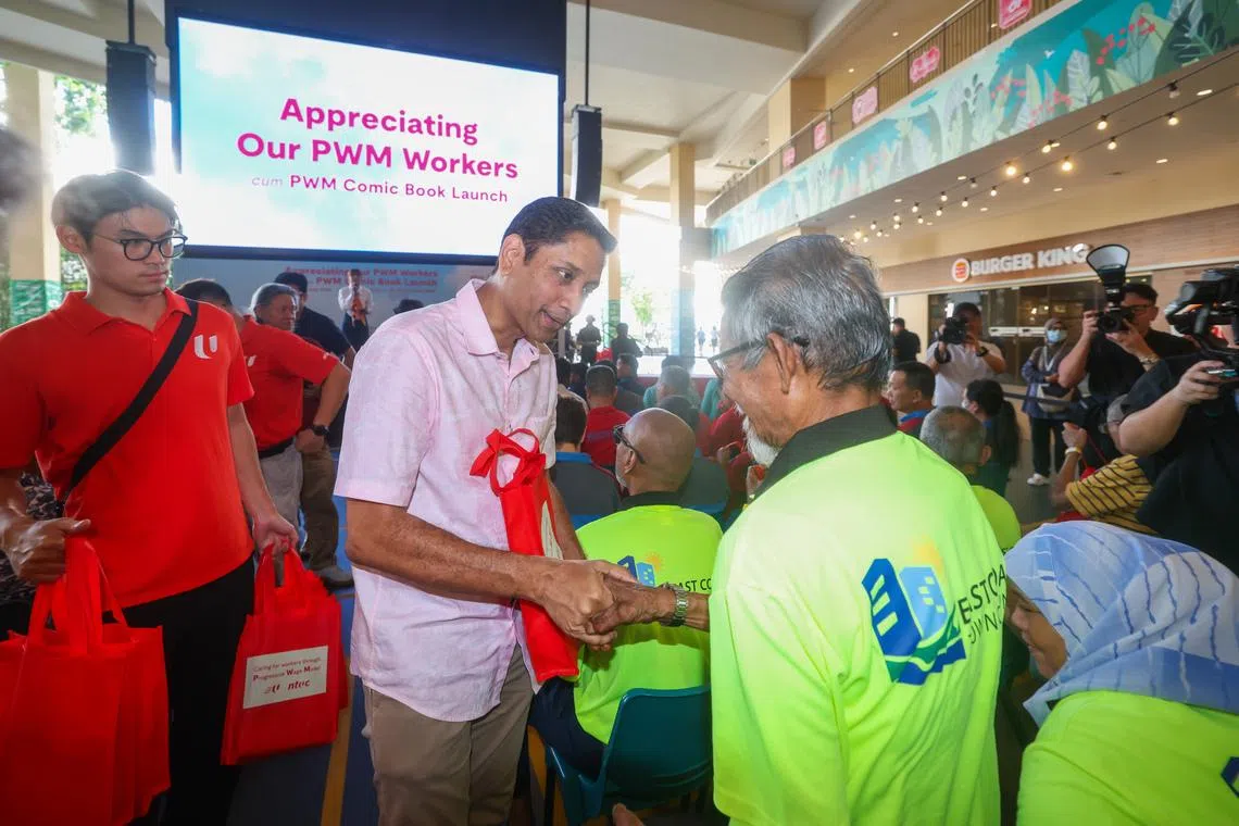 Minister of State for Manpower Dinesh Vasu Dash presents appreciation packs to workers during the launch of NTUC’s “Appreciating Our PWM Workers” campaign at HeartBeat@Bedok.