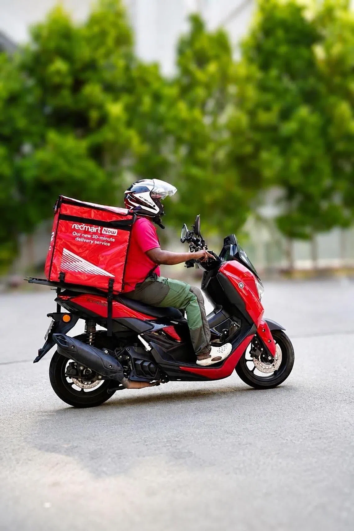 A RedMart Now delivery motorbike. The service has expanded its fleet of delivery vehicles by four times to meet customer demand.