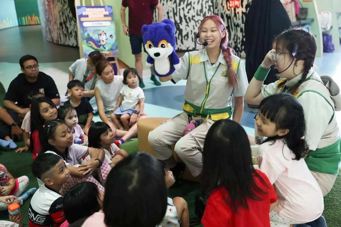 A storytelling session with Smiley the squirrel imparts lessons on wants and needs and the importance of saving money.
