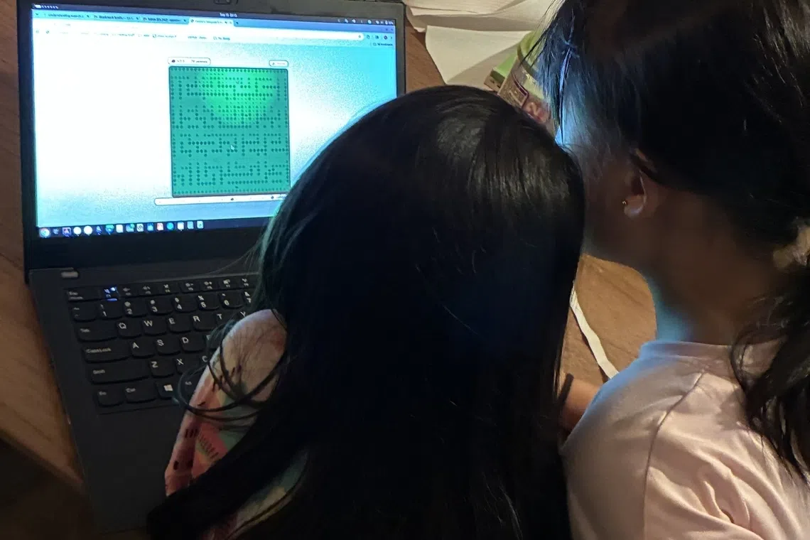 children using automated ai assistant at home to create games from scratch